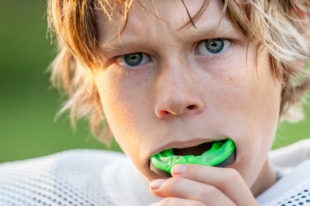 child using protective mouth gear 