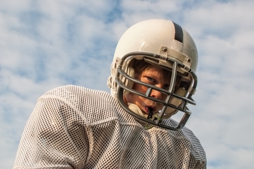 kid playing football