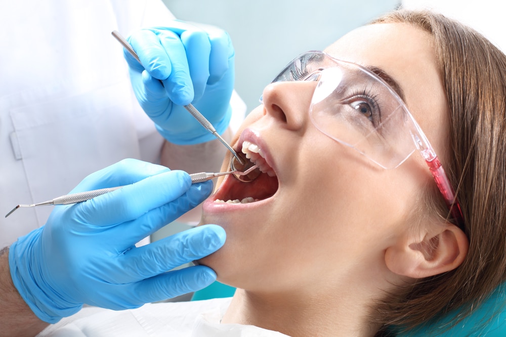 Woman having a cavity worked on by a dentist in Las Vegas