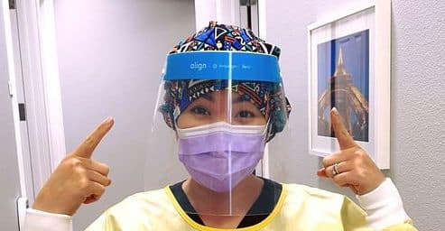 staff members wear face shields during exams and treatment