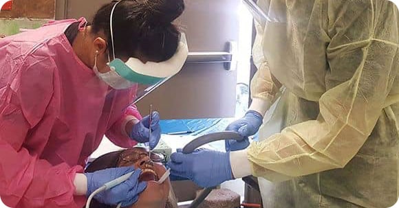 Image taken from project BDG, where dentists perform dental treatment for a female patient
